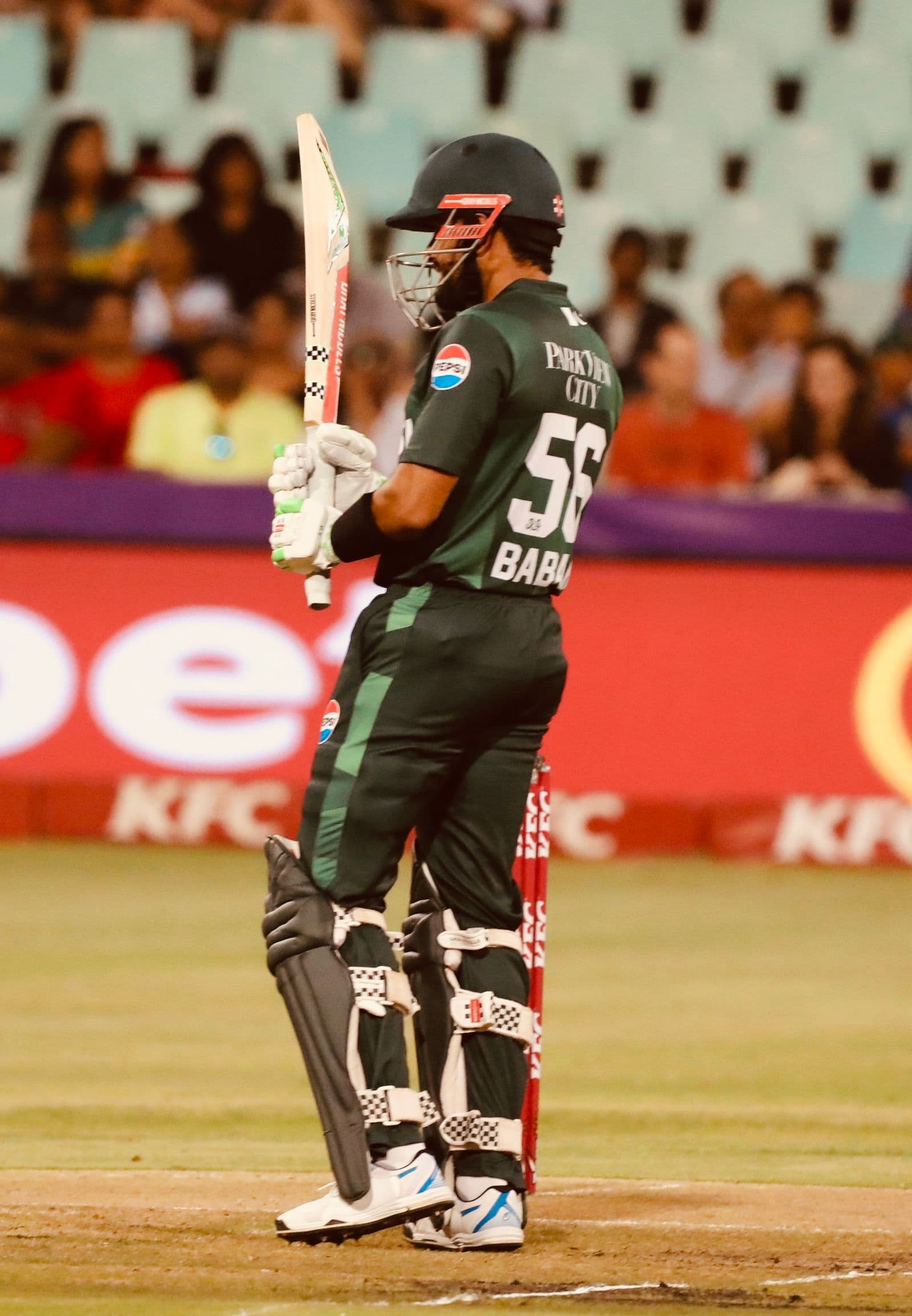 Cricket player walking from the crease